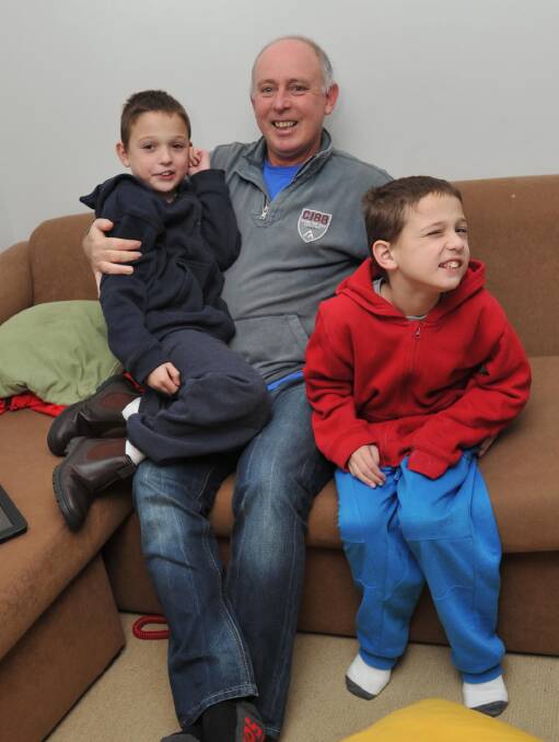 NEW PUSH: Tony Nechvatal and his two sons, Zac and Ryan, in a file photo. Mr Nechvatal is advocating for more support services for autistic children in Wagga.