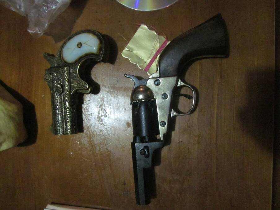 Two of the pistols seiezed during the search warrant. 
