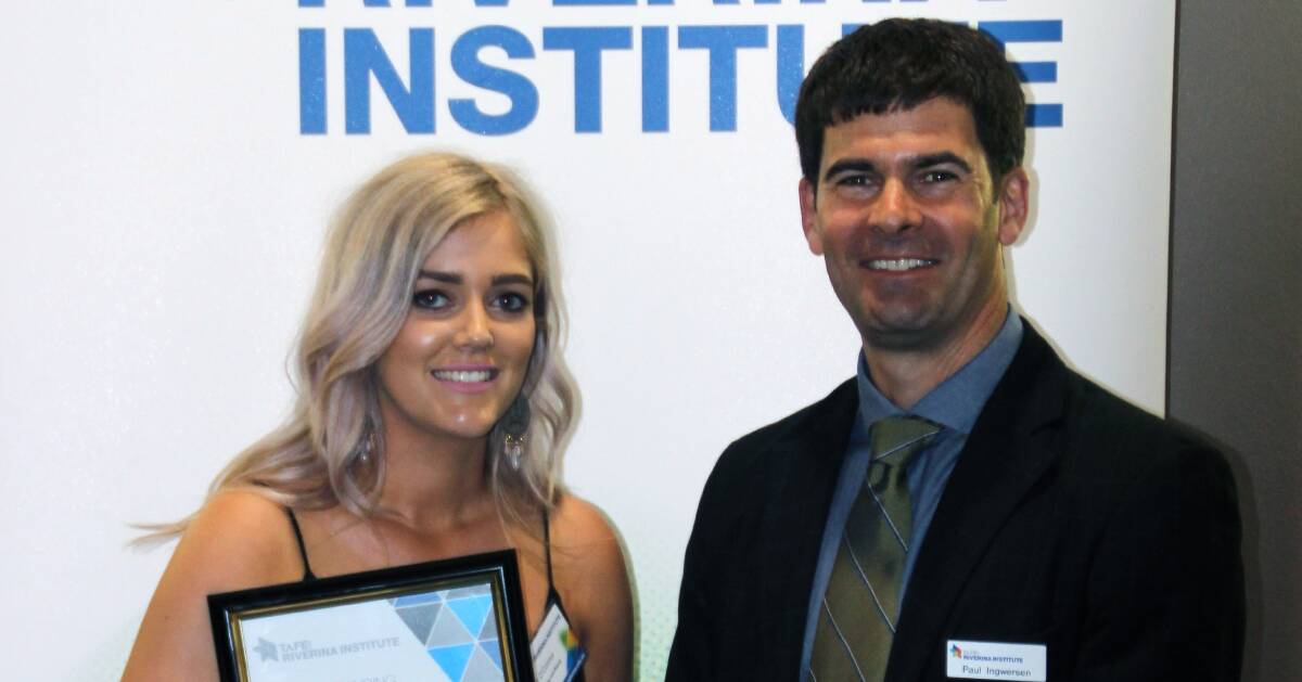HARD WORK PAYS OFF: Wagga TAFE Student of the Year Toni O’Connor with TAFE Riverina Institute Director Paul Ingwersen.