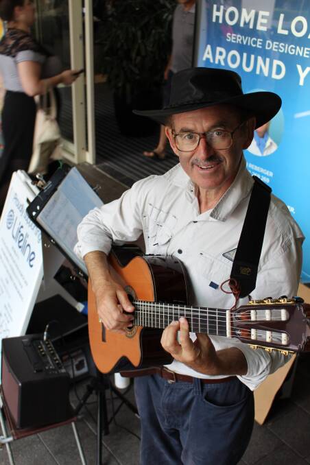 MAKING A DIFFERENCE: Murray Mandel performs outside Wagga Marketplace on Tuesday to raise money for Lifeline. 