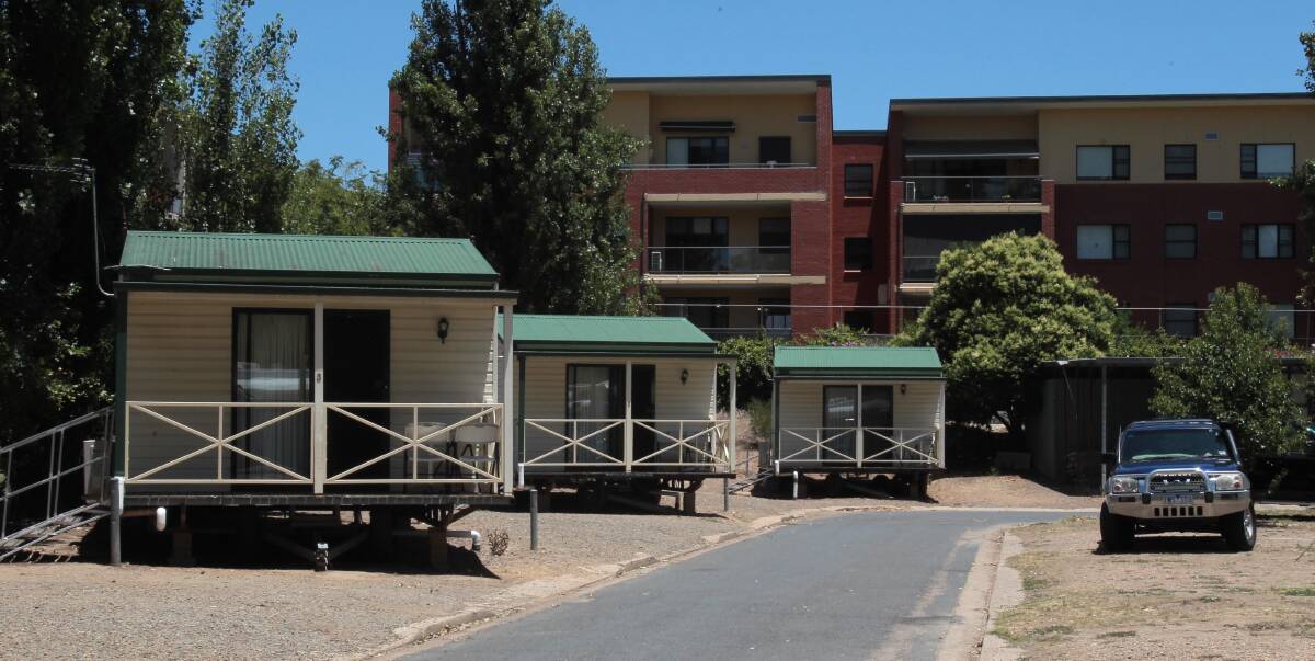 MUCH RELIEF: The Wagga Caravan Park's cabins were finally returned to their normal site beside the Wagga Beach on Thursday after nearly two months. 