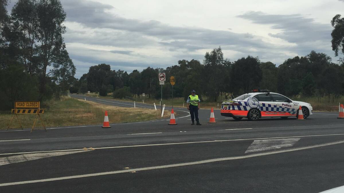 Police block motorists from seeing the scene of the crash.