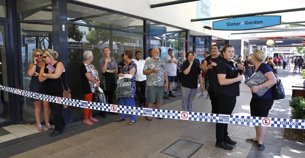 LOTS OF INTEREST: More than 100 Wagga residents stopped in awe to watch the chaos unfold as emergency services fought the blaze. Picture: Les Smith