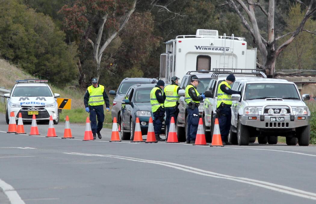 NO WARNING: Wagga police officers perform random drug testing along Pearson Street over the weekend to catch dangerous motorists. Picture: Les Smith