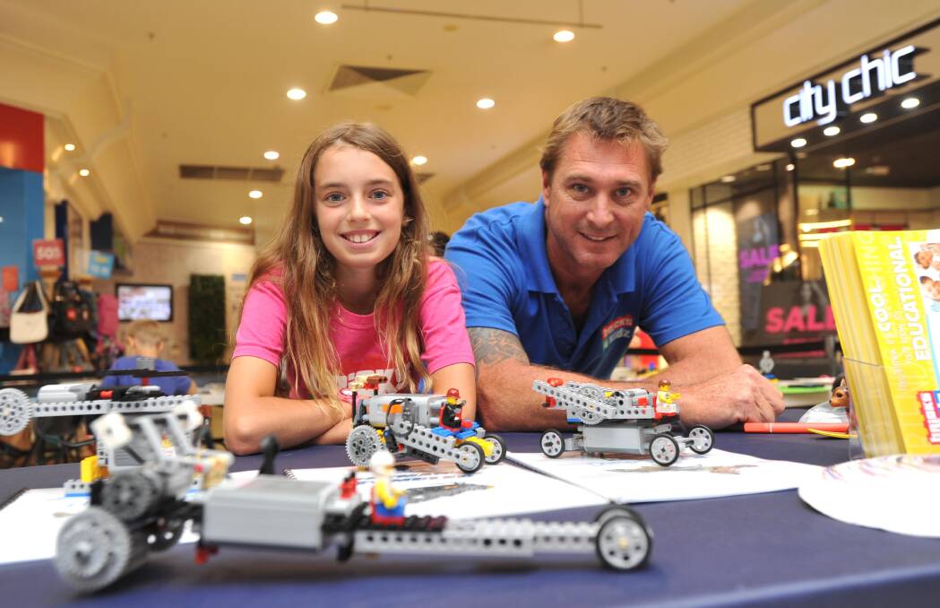 Loving Lego: Indianna Cornuis-Randall and Shane Randall at the Bricks 4 Kidz school holiday entertainment stand at the Marketplace. Picture: Laura Hardwick.