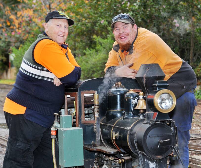 Passion for rails: Wagga Society of Model Engineers president Jim Weeden with fellow enthusiast, Richard James at the Botanic Gardens. Picture: Kieren L. Tilly. 
