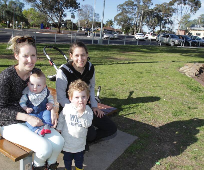 Park upgrade: Alyssa Nesire with her kids Roman, six-months, Ezekial, 2, and her friend Mel Barrett at Apex Park after the upgrade. Picture: Les Smith.