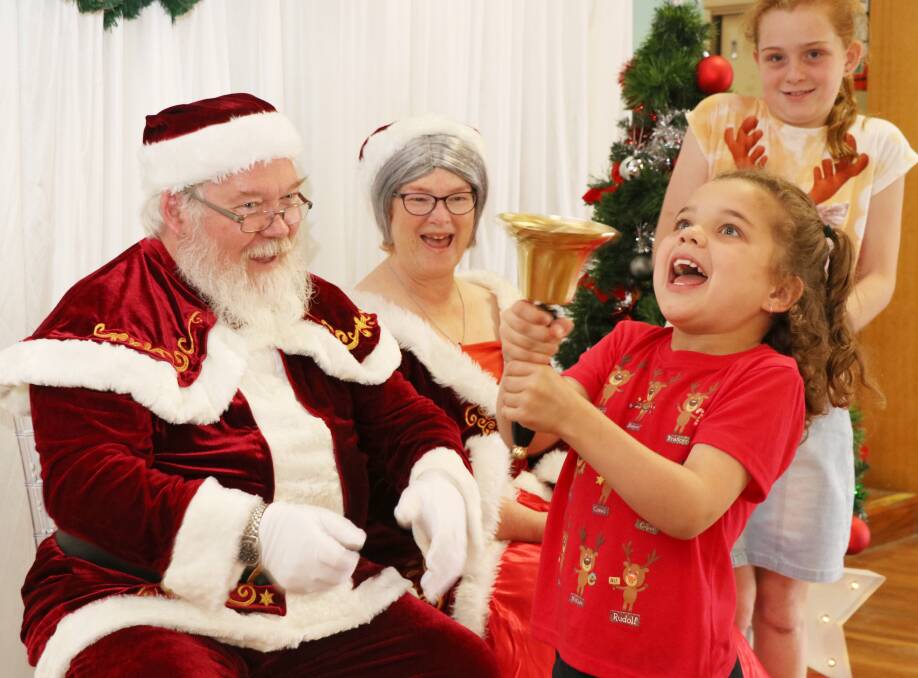 Happy times: Abbey, 7, and Katie, 9, were thrilled to meet Santa during the sensory santa session. Picture: Rebecca Hyland.