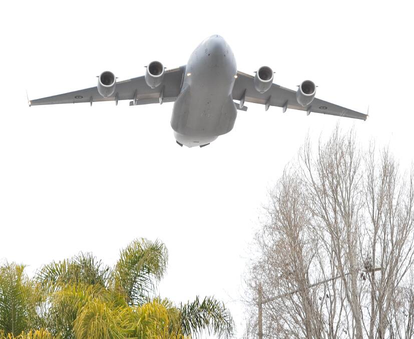 Fly past: The huge plane flew over Wagga earlier this year for the 75th anniversary of the Wagga RAAF Base. Picture: Kieren L.Tilly 