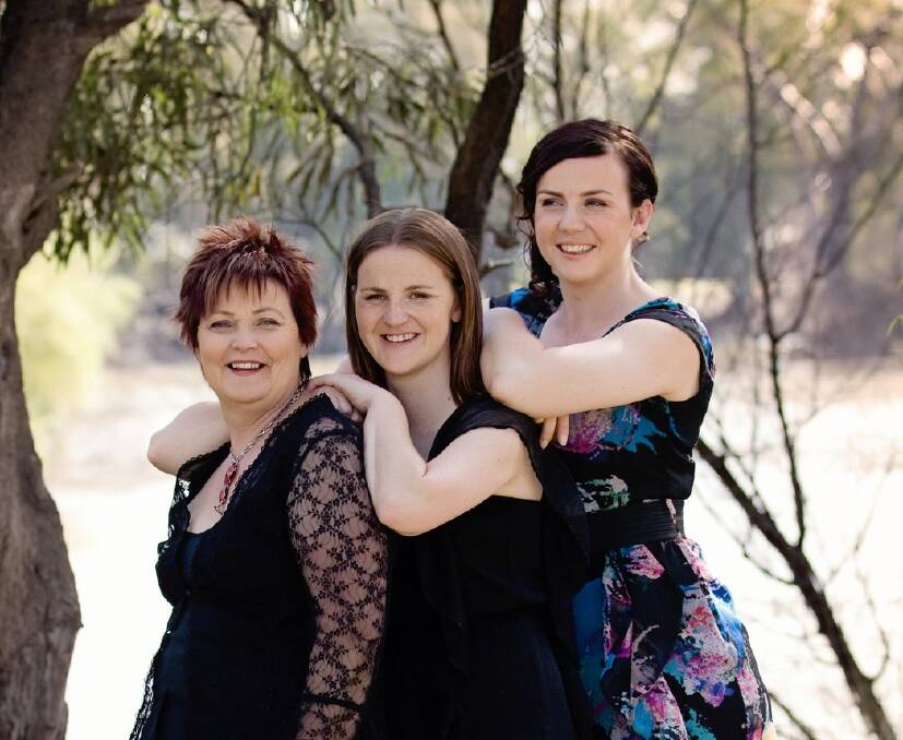 Nikki Storm, middle with her Mum, Andrea and her youngest sister who have been her greatest support.