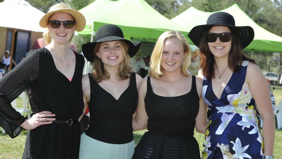 Harriet Raleigh, Charlotte Fletcher, Amey McMicking and Teagan Harmon catch up at Lockhart Picnic Races last year. Picture: Les Smith