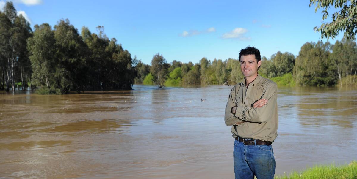 NOT THE RIVER: Borambola farmer Lachlan Harris has seen water from the river spill into his paddocks but he considers himself lucky as some Riverina growers have lost up to 80 per cent of their crop. Picture: Laura Hardwick