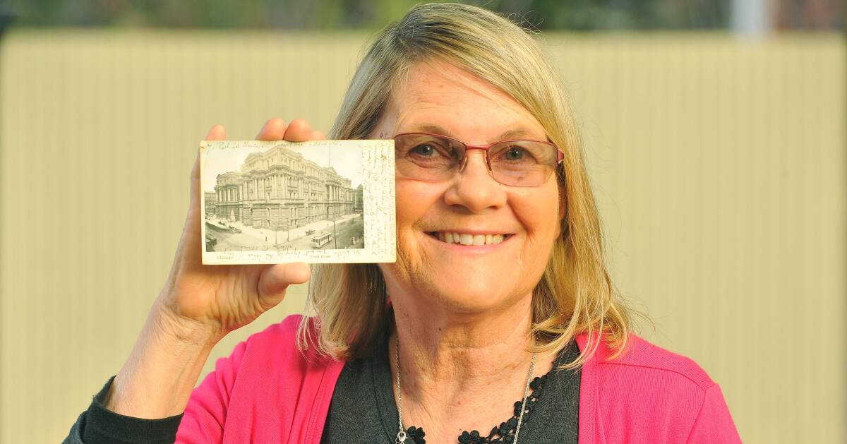 STORIES: Margaret Francis holds a postcard written from Miles Franklin to her grandfather, found during her work documenting her family's history.  Picture: Kieren L. Tilly