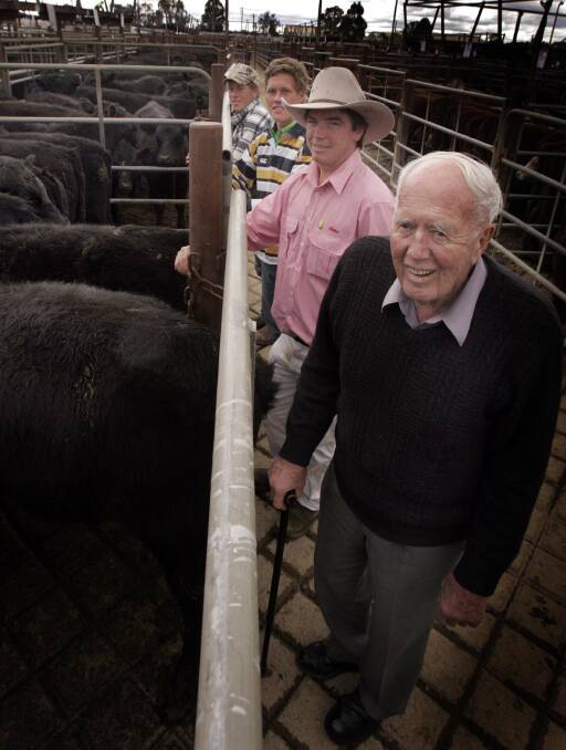 REMEMBERED: Stan Henwood, pictured in 2010 at the saleyards with James Tierney and grandsons James and Brenton Henwood, died in Wagga on Monday. 