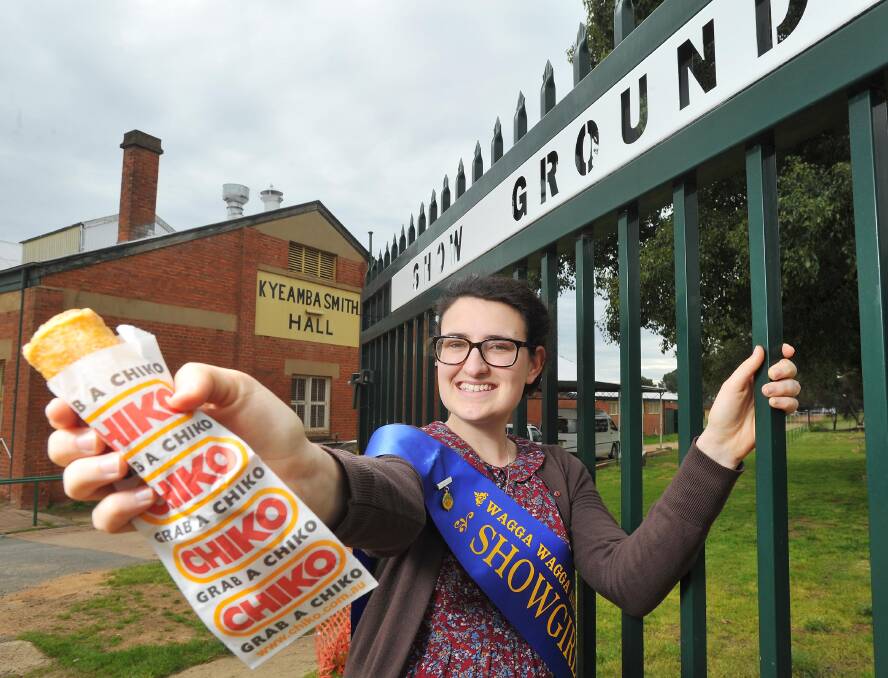SHOW ICON: Wagga Showgirl Emma Ball gives the traditional Aussie meal the seal of approval ahead of the show. Picture: Kieren L. Tilly