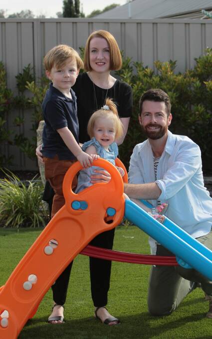 GREENER GRASS: Scott and Michelle Robertson with children Charlie and Lila,  are one of regional Australia's success stories.

