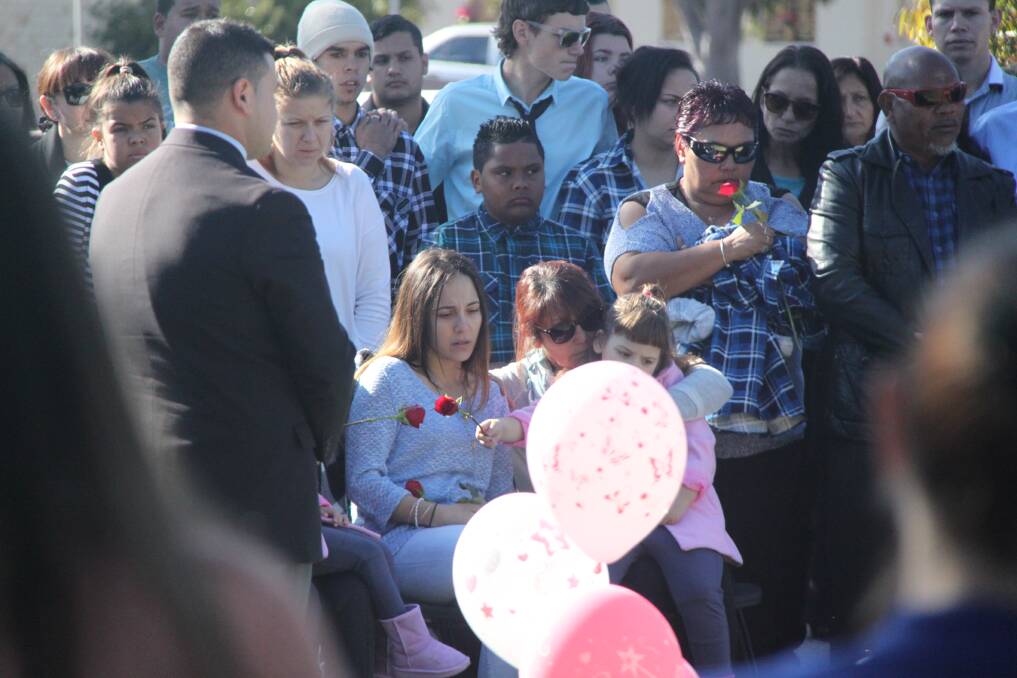 BROKEN: Karissa Undy is comforted by family and friends at Griffith Lawn Cemetery as she mourns the loss of her baby boy. Picture: Stephen Mudd