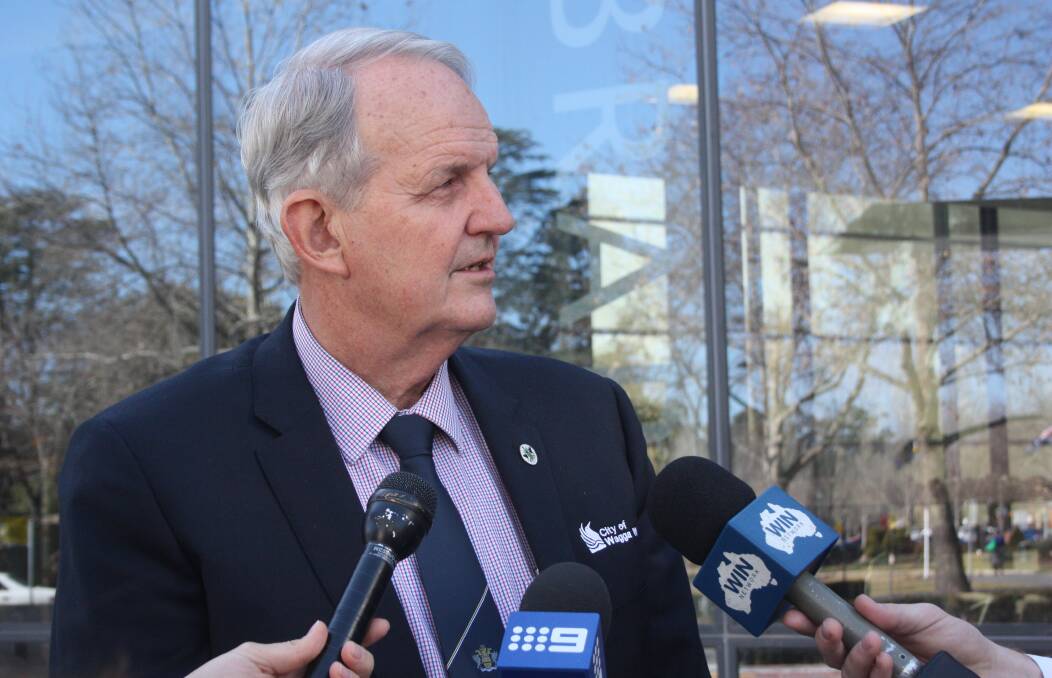 SCRUTINY: Wagga mayor Greg Conkey faces the media after council deferred a decision on who would handle the city's green waste.
