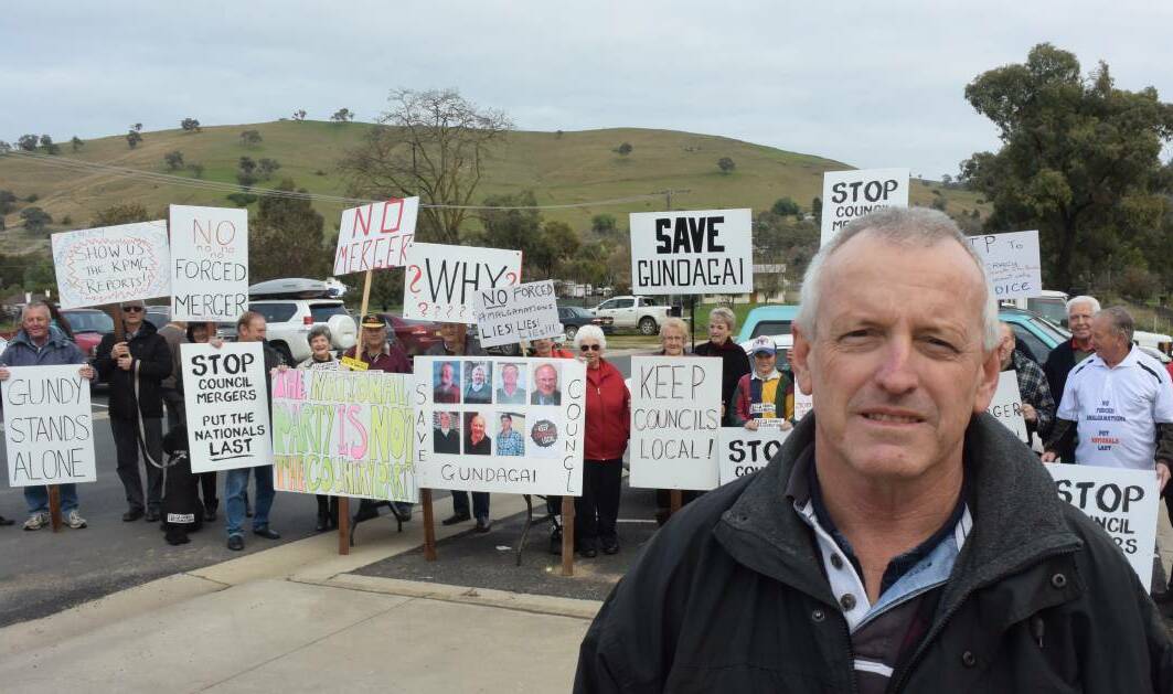 OUTRAGE: John Knight and Save Gundagai Shire protesters outside a South Gundagai polling booth during the last federal election.
