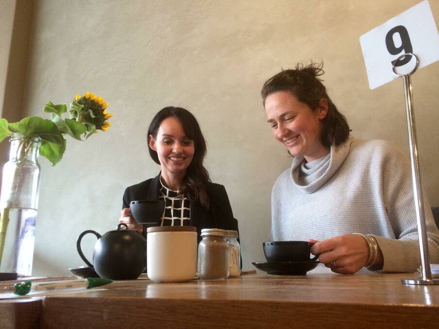 TRANSFORMED: Wagga entrepreneurs Michelle Bray and Jo Palmer can conduct business over coffee thanks to technologically-advanced ways of working outside a traditional office.