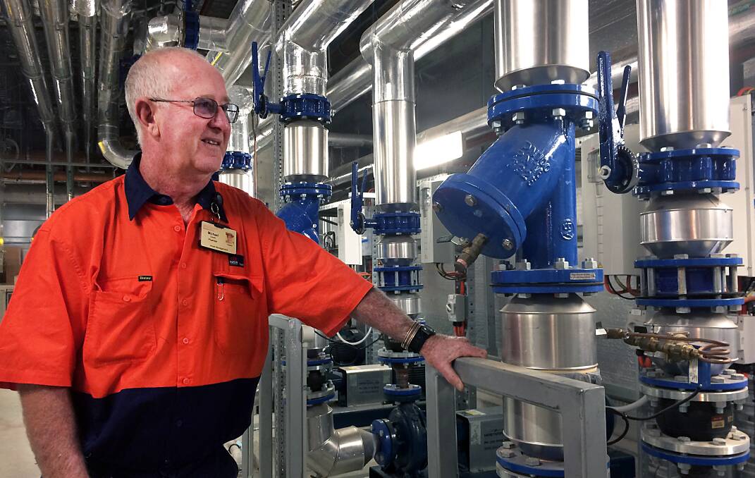 Hospital plumber Mick Geale inspects some of the pipework in one of the plant rooms.