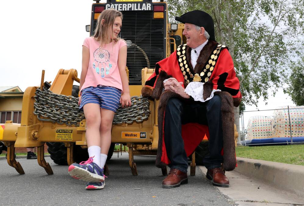 WHAT A YEAR: Mayor Greg Conkey talks to eight-year-old Sunnie Reynolds at the Little Big Day Out in October. After so many ups and downs in 2017, Cr Conkey is looking forward to big things in 2018. Picture: Les Smith.