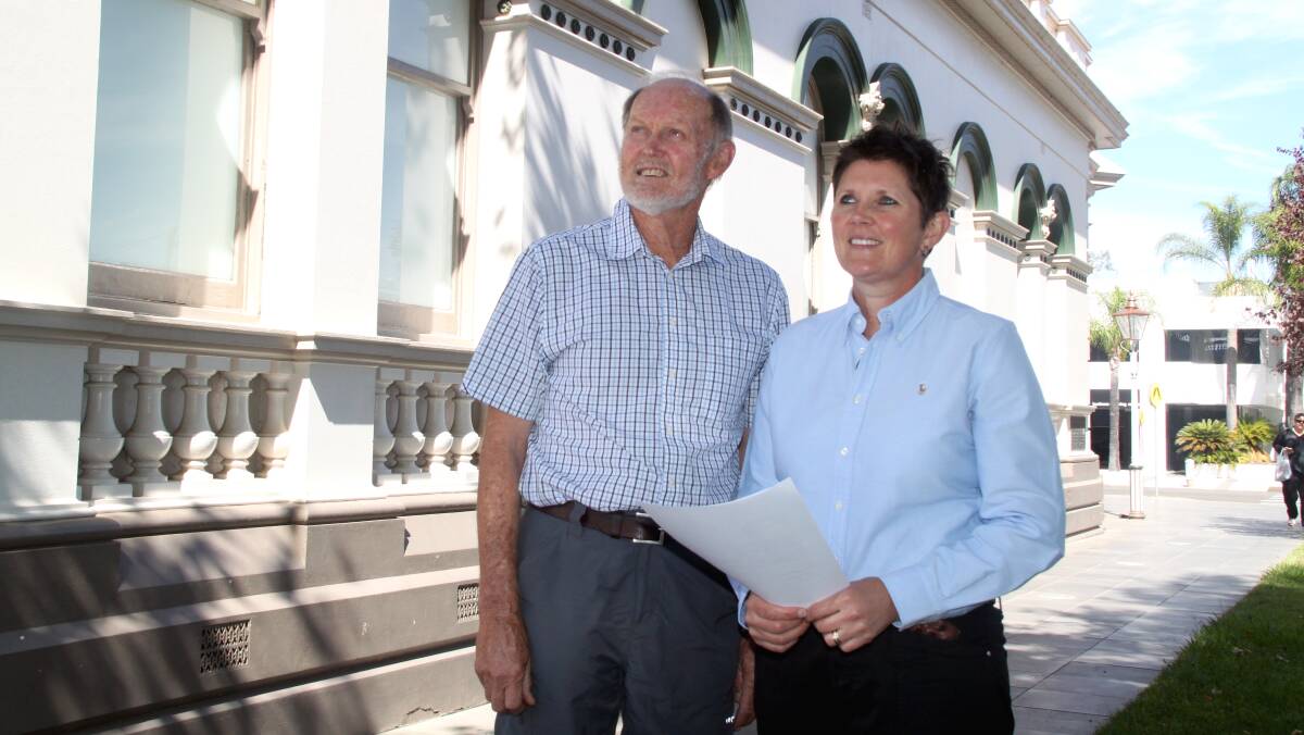 ON TRACK: Wagga Rail Trail secretary Ken Lansdown and chair Lisa Glastonbury with the consultant's contract, which was paid for with a crowd funding campaign that raised $50,000.