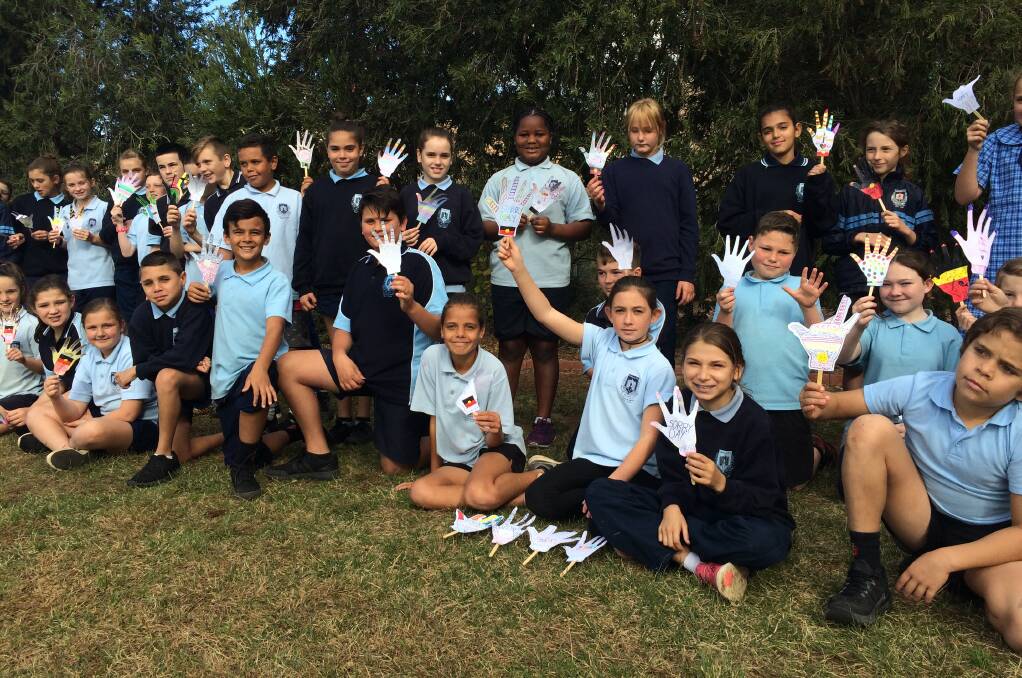 HAND IN HAND: Kids at Ashmont Public School on National Sorry Day. Picture: Madeleine Clarke