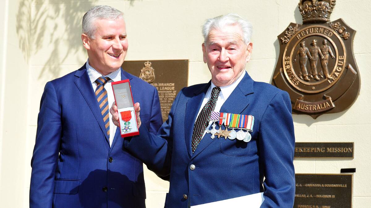 HONOURED: Bert Adams added the French Legion of Honour to his chest of medals after receiving it from Michael McCormack. Picture: Kieren L Tilly
