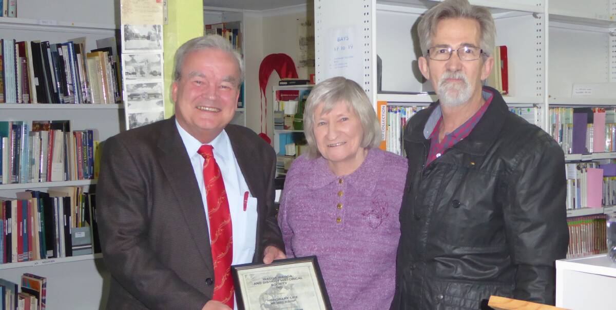 LIFE MEMBERSHIP: Sherry Morris flanked by Wagga and District Historical Society president Peter Gissing (left) and past president Geoff Burch after receiving life membership on Wednesday night. Picture: Contributed