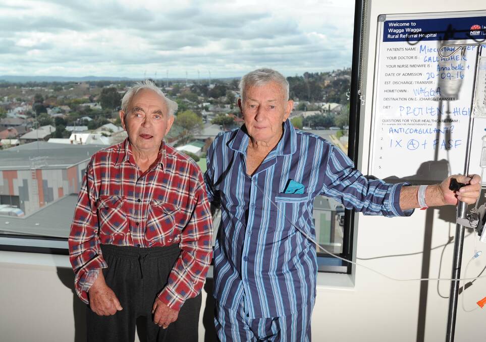 CATCHING UP: Recalling their days as young tradesmen helping to build Wagga Base Hospital has helped Mike Stefanowicz (left) and Ralph Lord pass the time in hospital. Picture: Laura Hardwick