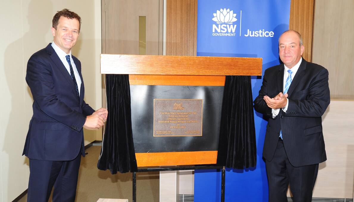 OFFICIAL OPENING: Attorney-General Mark Speakman (left) with member for Wagga Daryl Maguire unveils a plaque to mark the official opening of the Wagga courthouse redevelopment. Picture: Kieren L Tilly