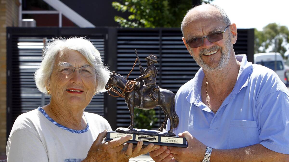 PRIZE: Zita Denholm and Wagga RSL sub-branch secretary Ken May with the Beersheba Challenge trophy donated by the sub-branch. Picture: Les Smith