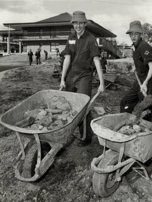 HELPERS: RAAF apprentices helping out on a Wagga community project in the 1960s or 70s. RAAF Base Wagga has long been an important part of the community.