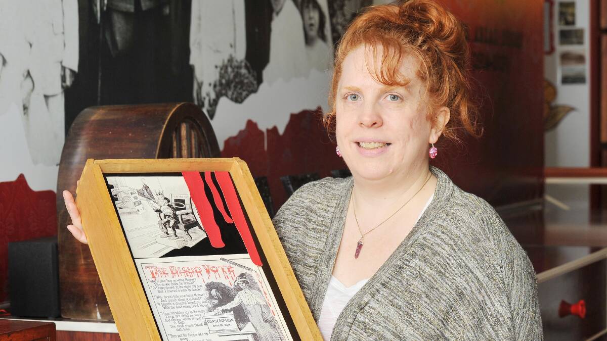 CONTROVERSIAL VOTE: Museum of the Riverina curator Michelle Maddison with copies of two colourful World War I anti-conscription posters. Picture: Kieren L Tilly