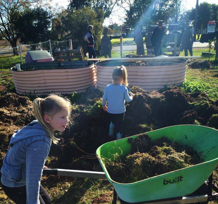 GREEN THUMBS: Inika and Xanthe Hutchins, of Grong Grong, at work in the village's earth park. Picture: Contributed