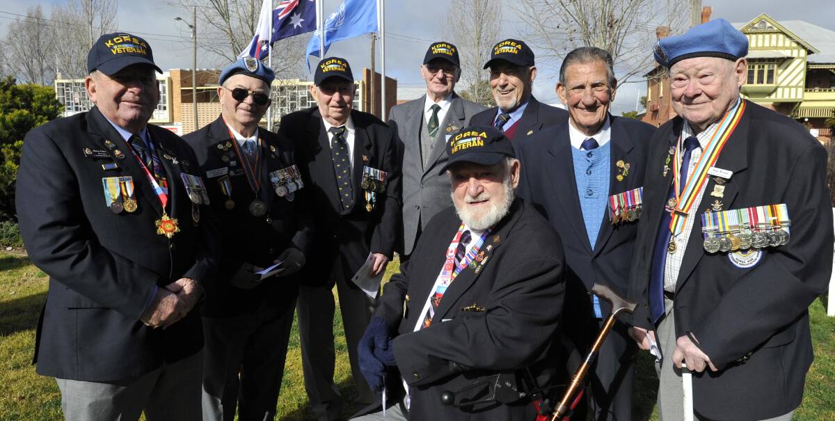 VETERANS: At Wagga's Korean War commemorative service were veterans, from left: Harry Edmonds, Alan Evans, Colin Anderson, Bob Menzies, John Laughton, Alex Ouchirenko, Norm Jeffs and Stan Wood. Mr Jeffs is a World War II veteran. The other men fought in Korea. Picture: Les Smith