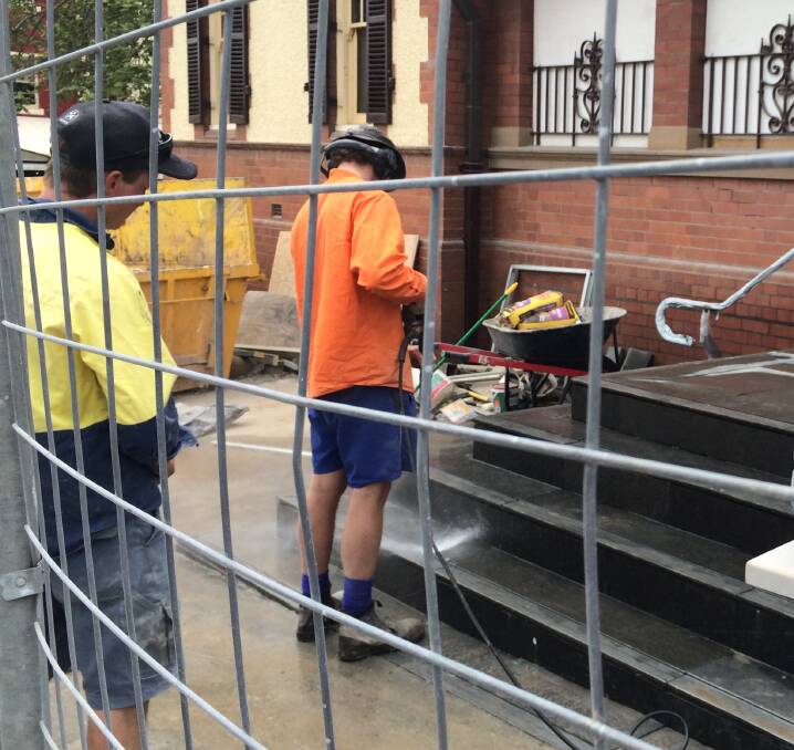 COURTHOUSE STEPS: Workers clean up new steps at the Wagga courthouse. Picture: Ken Grimson