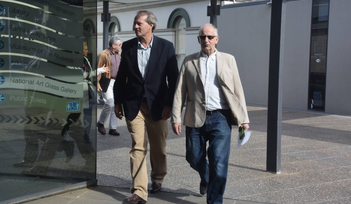 CRISIS MEETING: Doug Clarke (right) walks into a meeting with Wagga City Council. Picture: Ken Grimson