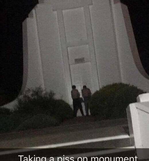 SNAPCHAT: The two teenagers urinate on Albury's war memorial.