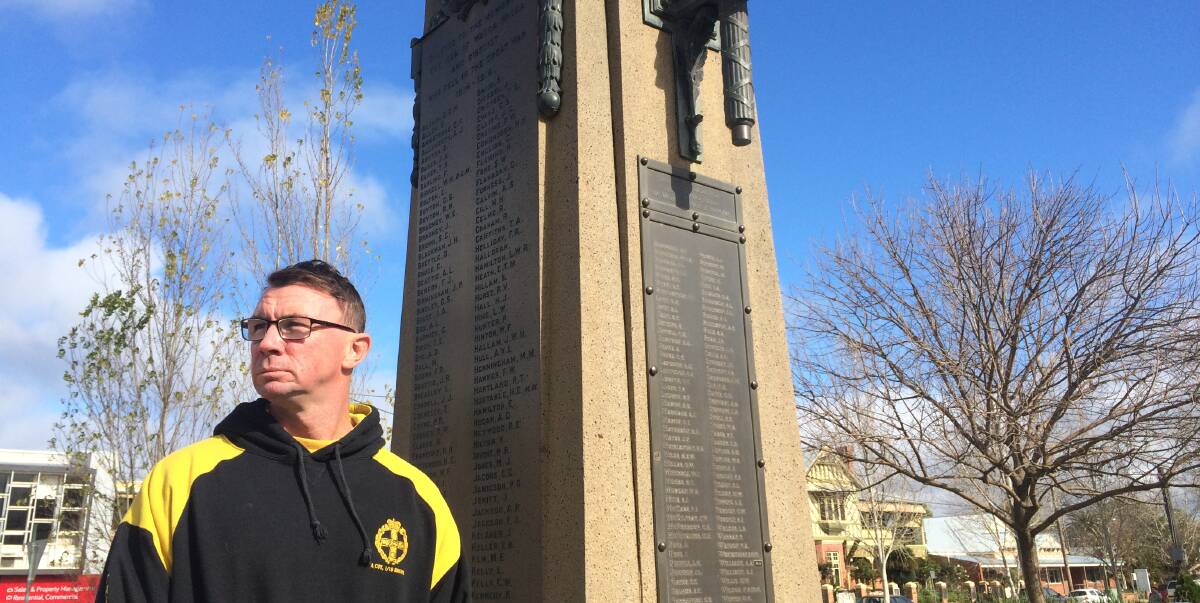 HONOUR: Before flying to France, Ian Mason stands at the Wagga Cenotaph which contains the names of district men killed at Fromelles and Pozieres during the Battle of the Somme in 1916. Picture: Ken Grimson