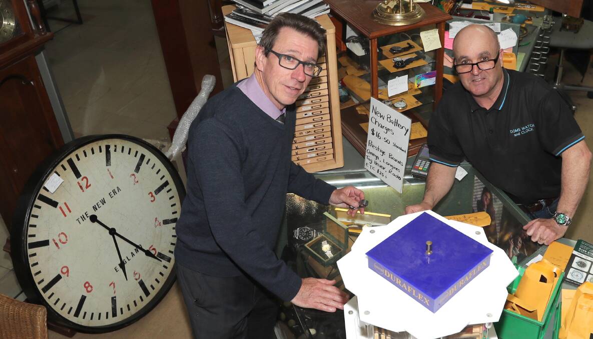 IT'S TIME: Wagga MP-elect Joe McGirr picks up his watch from Dom Tancredi at Dom's Watch and Clock Repairs a couple of hours after being declared the byelection winner. Picture: Les Smith