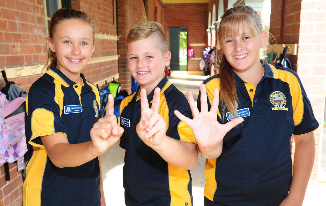 ANNIVERSARY: South Wagga Public School students Nina Riethmuller, 11, Fletcher Wilson,11, and Chelsea Clarke, 11, wearing souvenir shirts to celebrate 125 years. Picture: Kieren L Tilly 