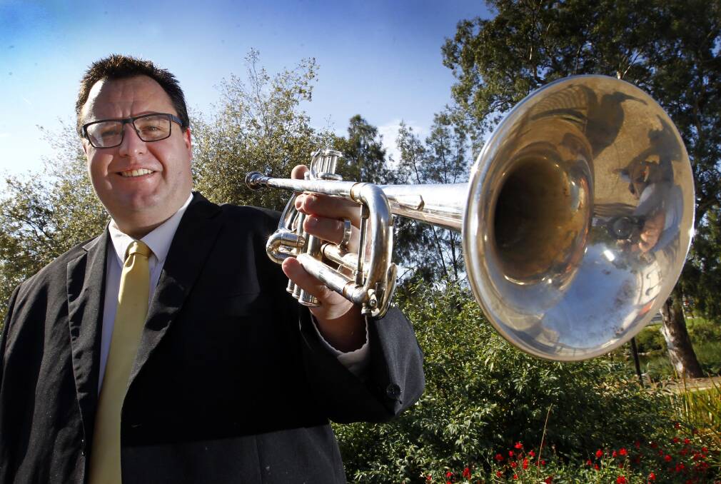GOOD VIBRATIONS: Tim Chandler prepares his instruments to revive a Wagga brass band for the musical community. Picture: Les Smith