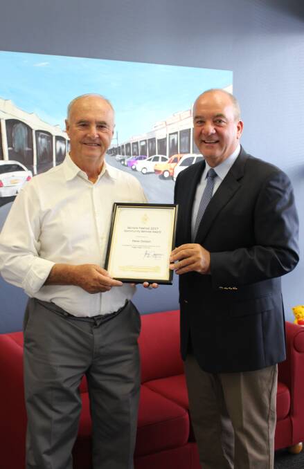 RECOGNITION: Peter Dolden received a community award during the Wagga Seniors Festival for his work in cleaning up the roads, presented by Wagga MP Daryl Maguire. 
