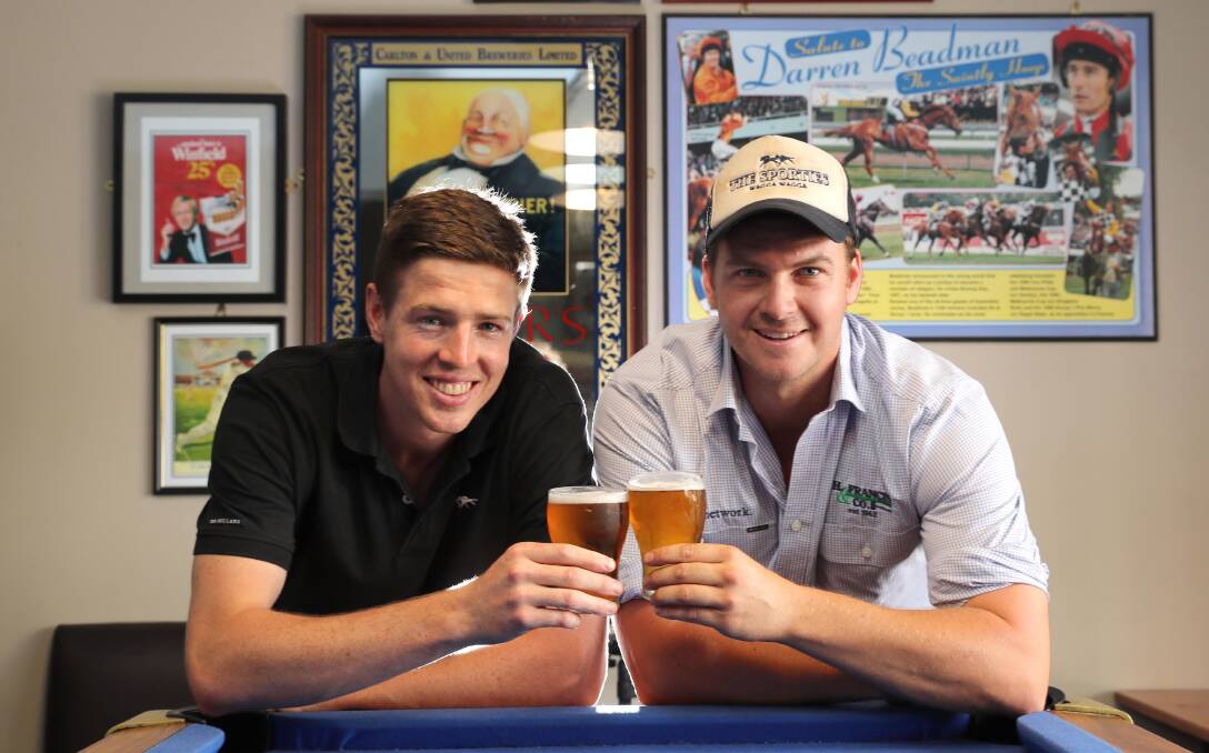 CHEERS: Sportsmen's Club Hotel manager Ben Stratton and event founder Matt Hawker prepare to host the ultimate Aussie showdown on Australia Day eve. Picture: Les Smith 