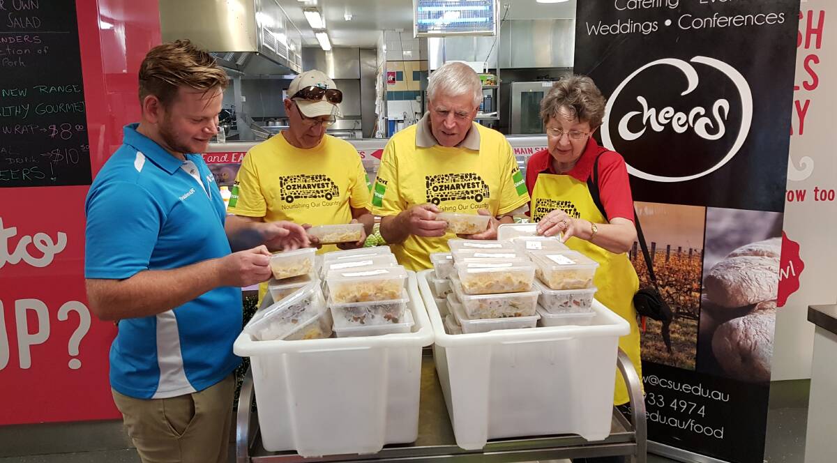 FROZEN FOR ALL: Representatives from Charles Sturt University's CHEERS team hand over free frozen meals to OzHarvest ahead of the summer break. Picture: Supplied