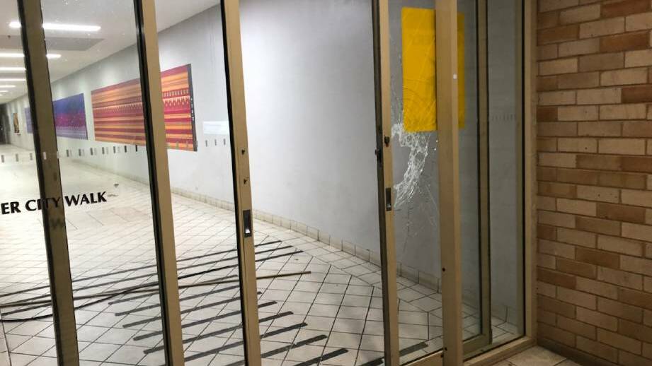 SHATTER: The smashed glass door of the Sister City Arcade in Baylis Street from just one of the city's recent break and enters. 
