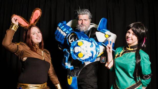 Some Gamma.con goers spent months on their outfits. From left, Maddison Turner as Velvet Scarlatina, Chris Schofield as Reinhardt, and Taylor Hogan as Lie Ren. Photo: Jamila Toderas