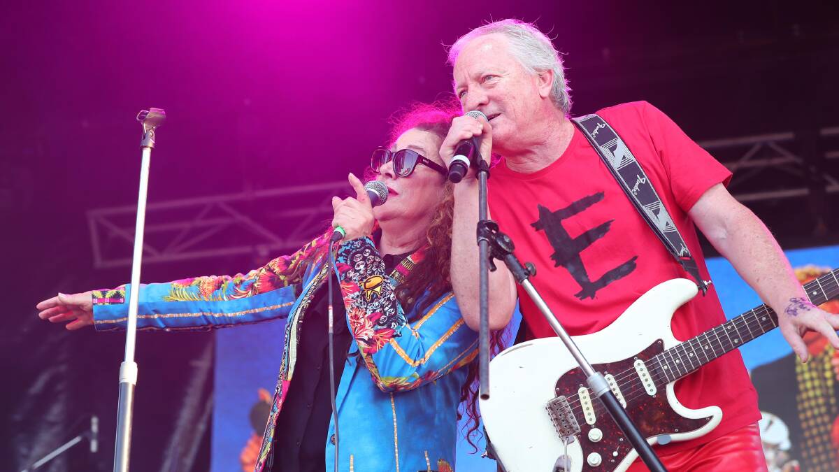RIGHT ON SONG: Eurogliders lead singer Grace Knight goes shoulder to shoulder with guitarist and back up vocalist Bernie Lynch during their set at Wagga's Rock at the Races on Saturday night. Picture: Kieren L. Tilly